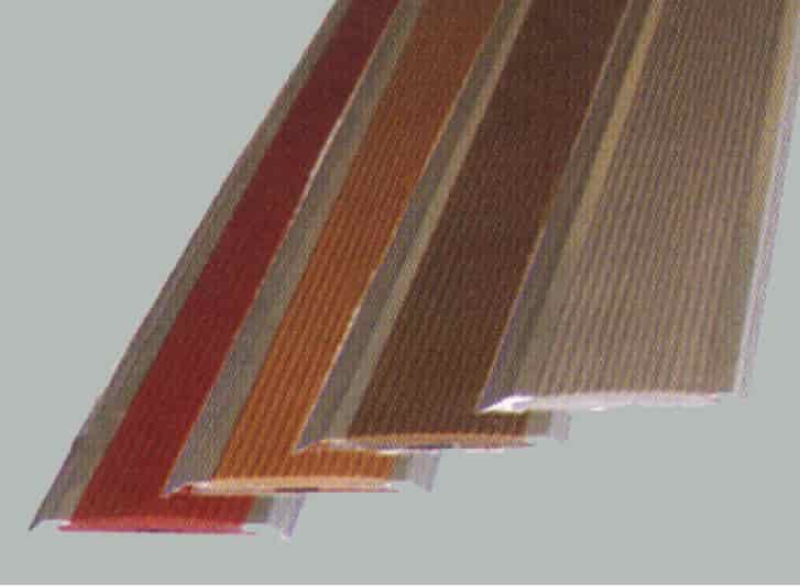 A row of different colored strips on a gray background, featuring aluminium stair nosing.