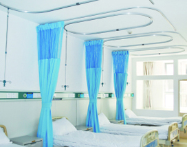 A room with several beds featuring PVC Corner & Wall Guard Protection Solutions from Warrior WPS.