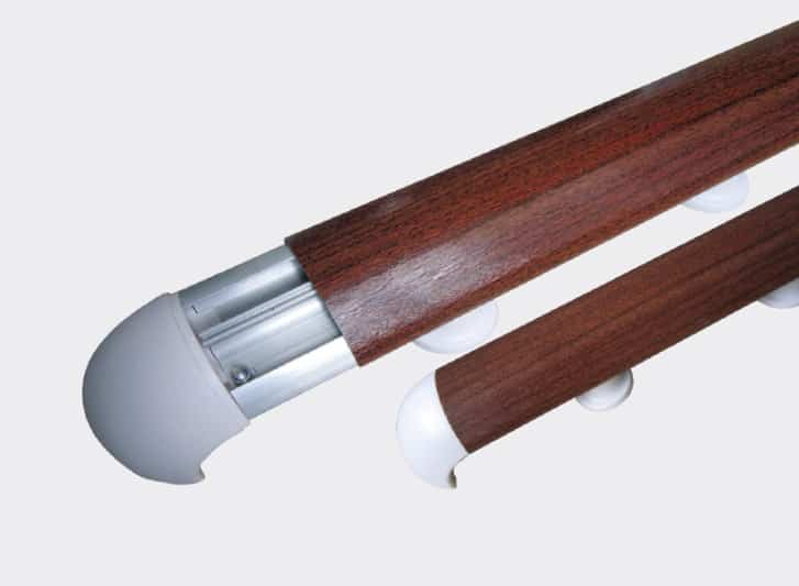A pair of wooden rails with PVC wall guards on a white background.